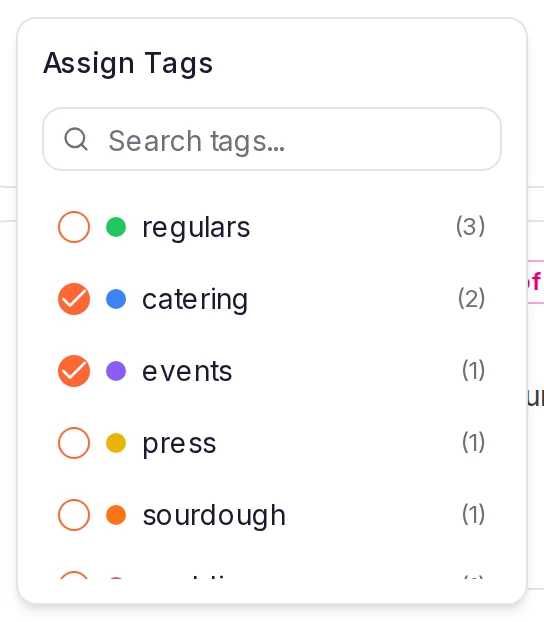 The Assign Tags popover: a search box, then the project's tags with their colors and counts, with catering and events ticked